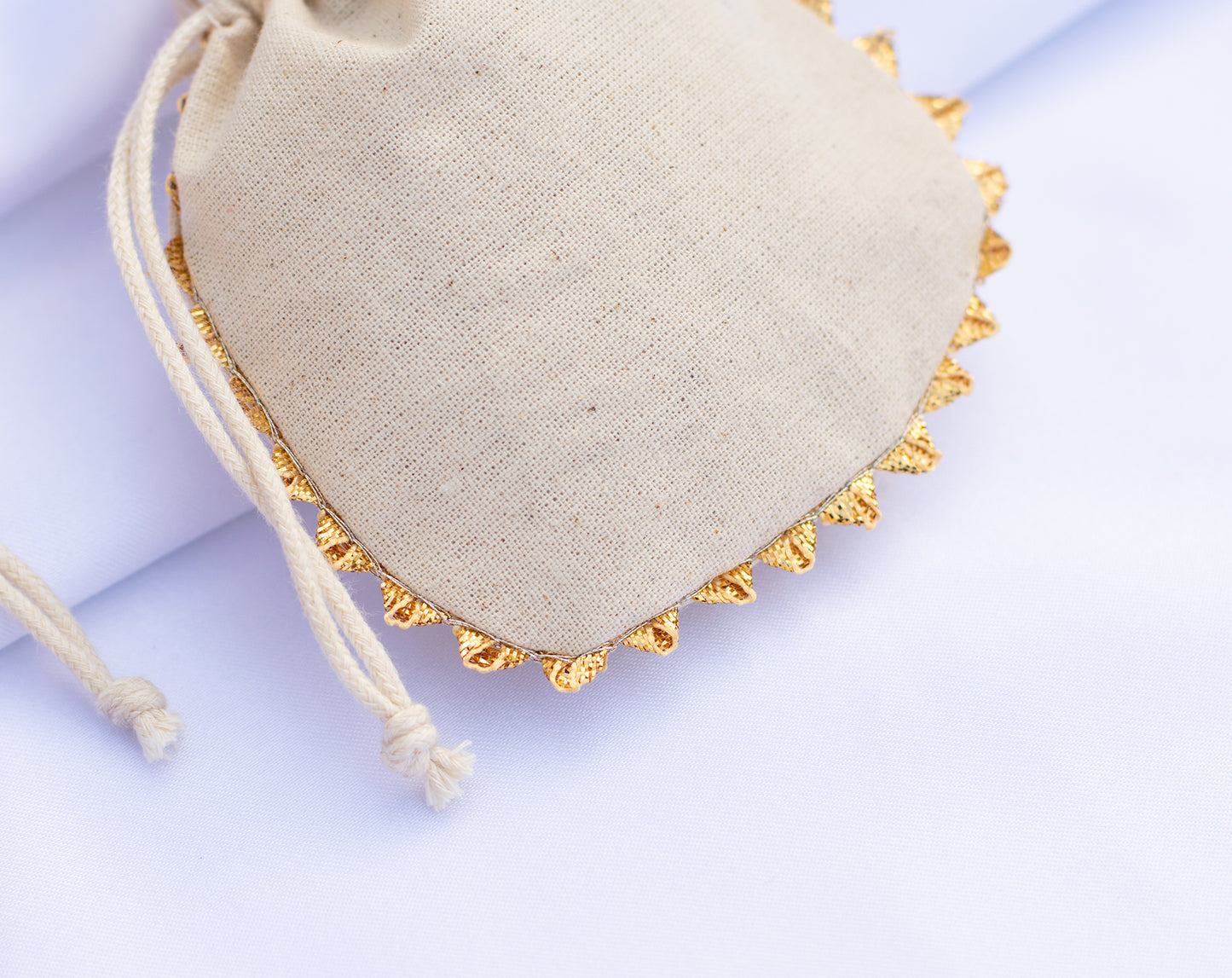 Pack of 100 - Round Golden Lace Ivory Drawstring Designer Pouch With Logo