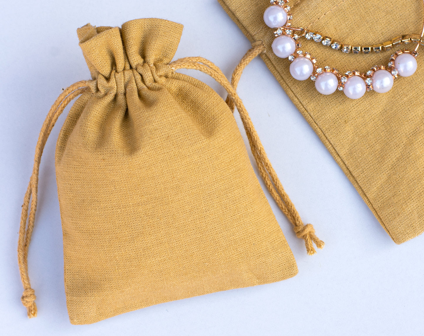 100pcs Eco-Friendly Cotton Drawstring Pouch With Logo in Wholesale